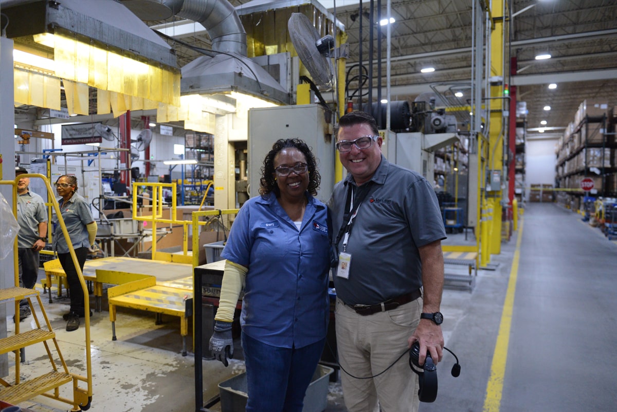 Smiling workers in factory