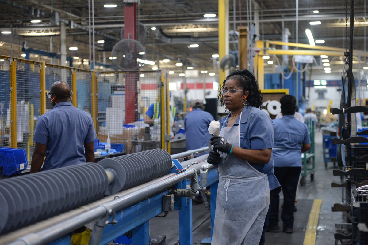 Smiling workers in factory