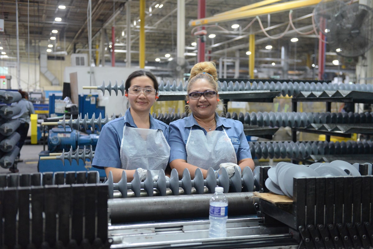 Smiling workers in factory